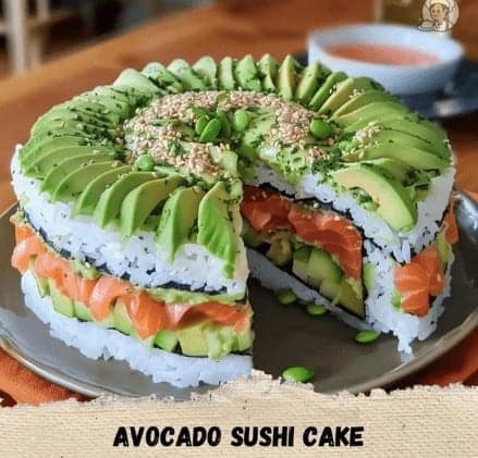 Large round cake made of sushi rice salmon and avocado layers.