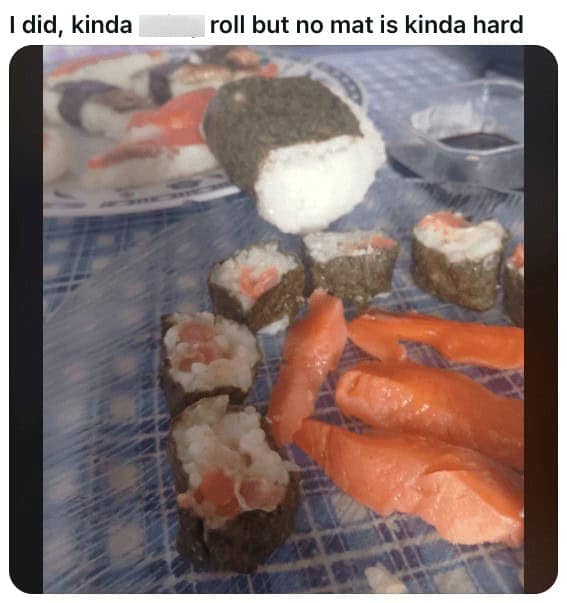 Poorly rolled homemade sushi log with uneven rice and seaweed.