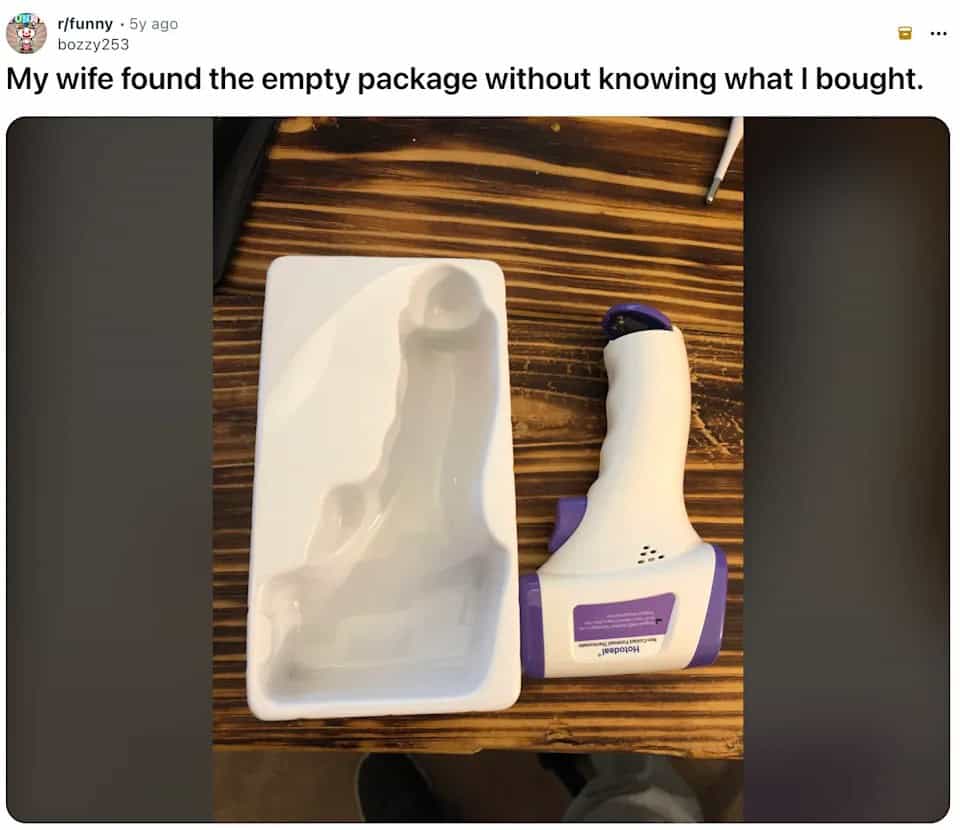 Empty plastic packaging with a suggestive shape that turns out to be a thermometer.