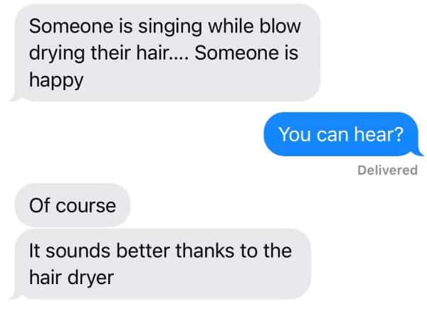 Parent texting a backhanded compliment about hearing singing over a hair dryer.