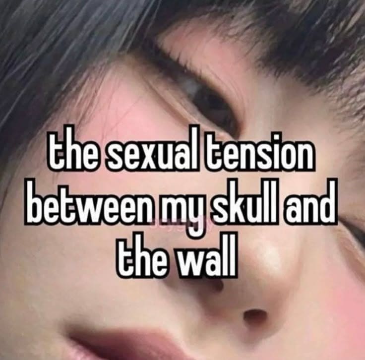 Close-up of a forehead with text about the sexual tension between the skull and a wall.