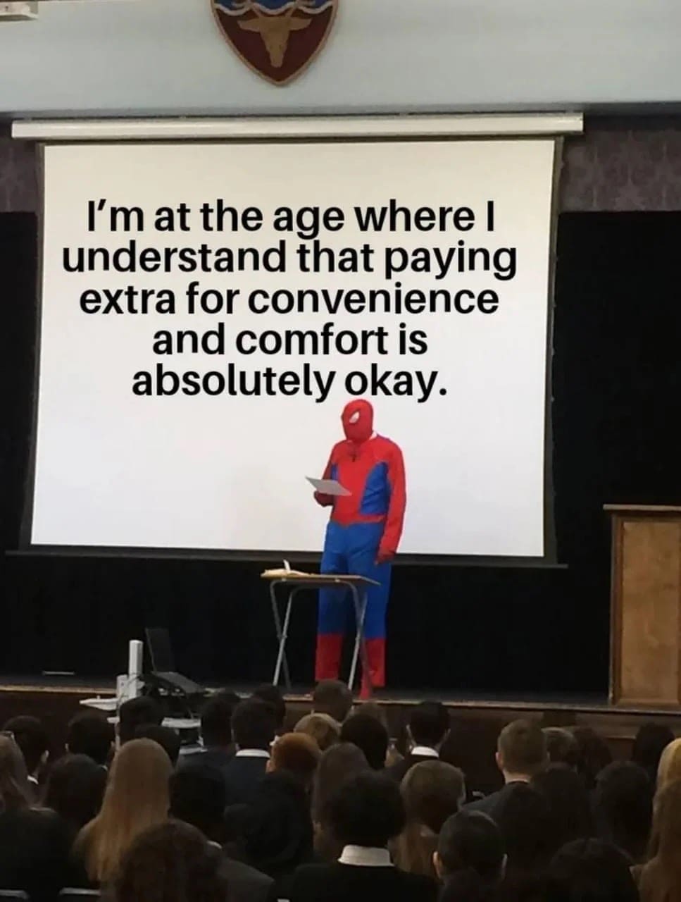 Spider-Man giving a presentation about paying extra for comfort and convenience as you age.