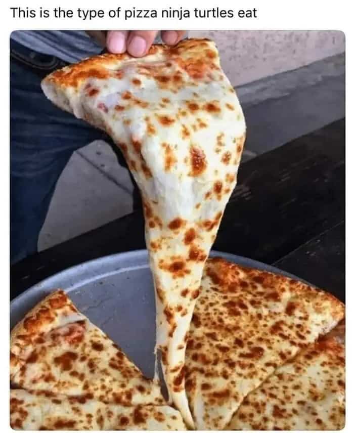 Extra cheesy pizza slice pull comparing it to Ninja Turtles cartoon food.