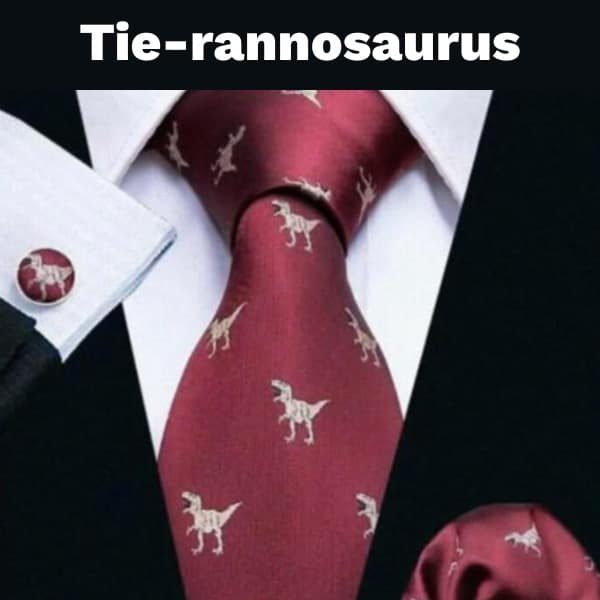 Red necktie featuring white T-Rex skeleton pattern labeled Tie-rannosaurus.