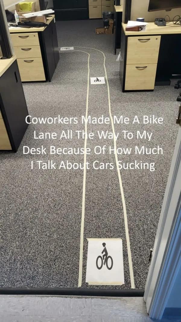 Office floor with tape bike lane for annoying cyclist coworker funny memes.