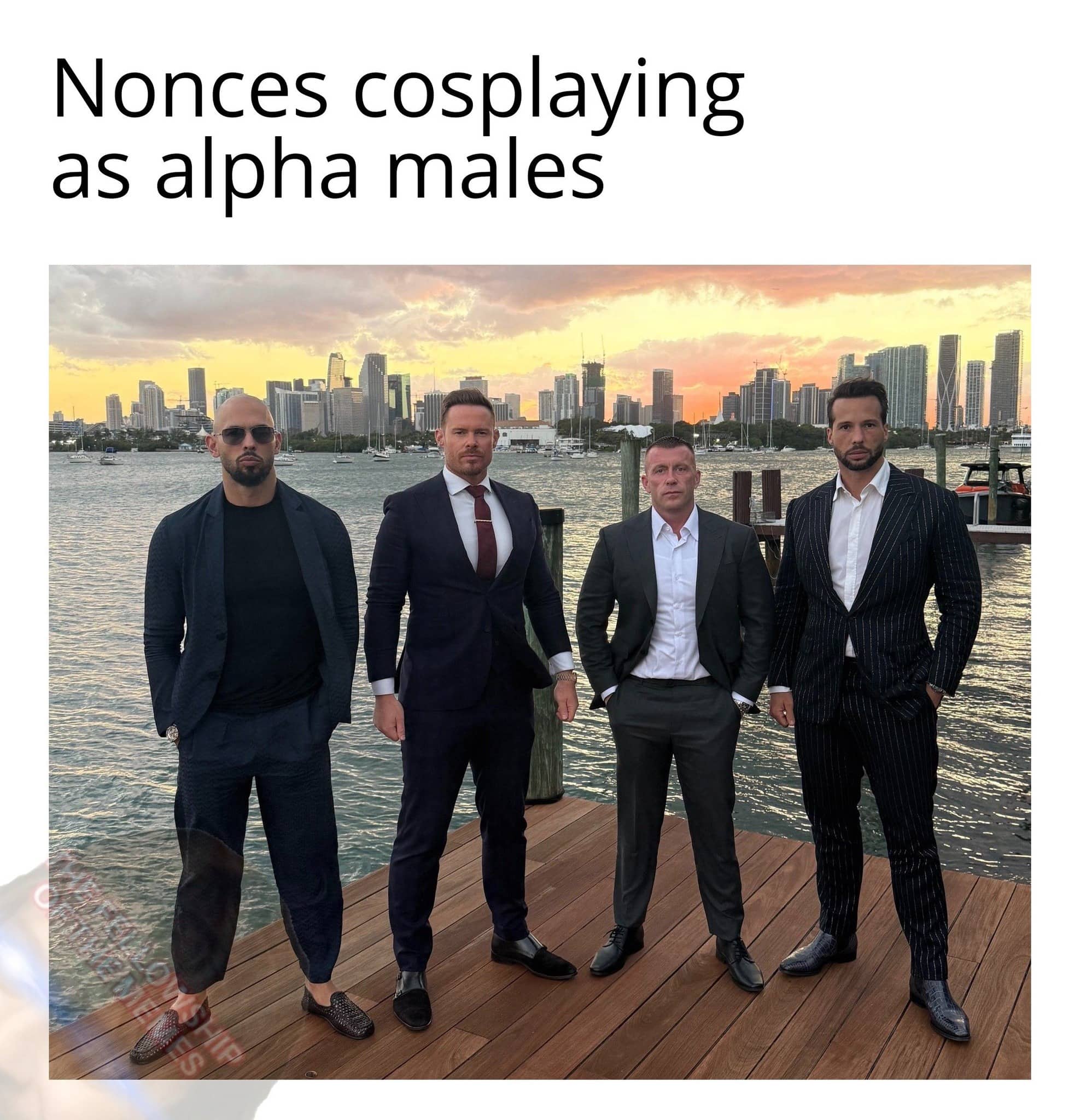 Four men in suits standing on a dock captioned as nonces cosplaying alpha males.