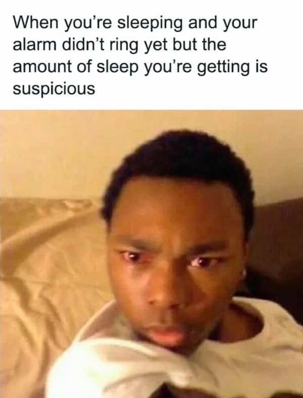 Reaction meme of man looking suspicious about waking up fully rested before alarm.
