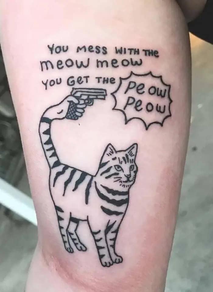 Cat tattoo with gun tail saying mess with meow meow funny memes.