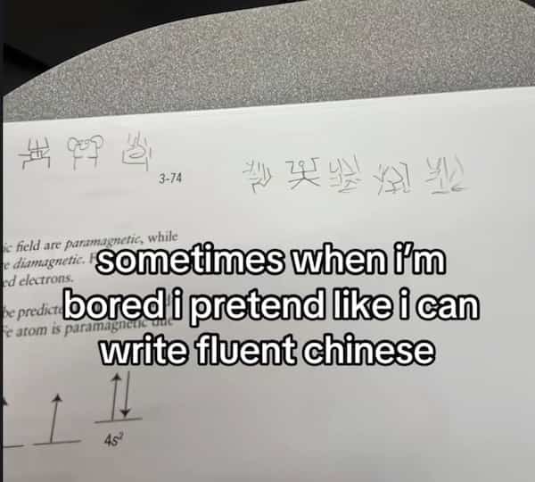 Chemistry homework with scribbles that look like fake Chinese characters.