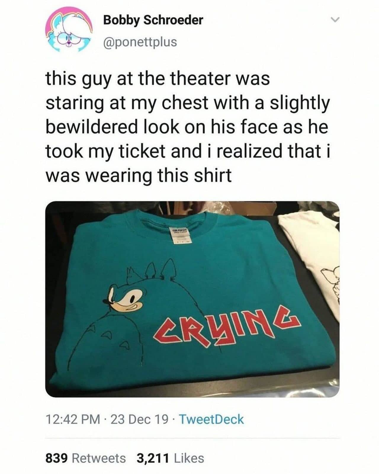 Person wears crying Sonic the Hedgehog shirt causing confusion at movie theater.