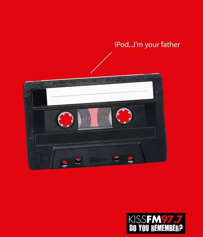 A funny print ad for KISS FM 97.7 showing an audio cassette telling an iPod "I'm your father," referencing Star Wars.