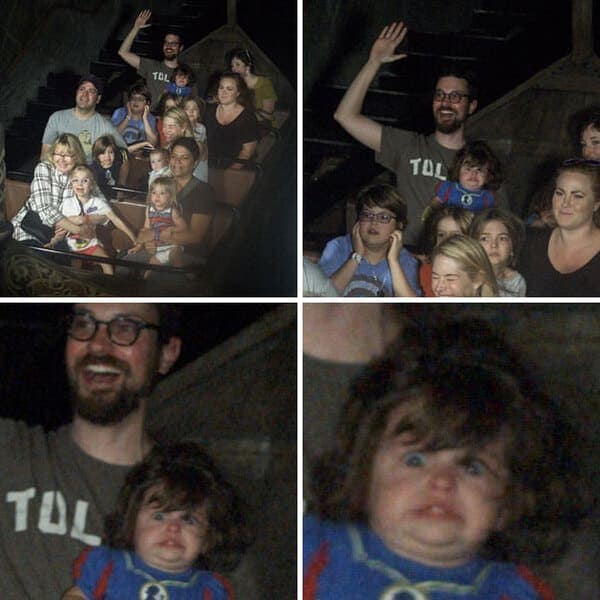 A funny rollercoaster picture of a toddler making a disgusted face while riding a log flume with happy adults.