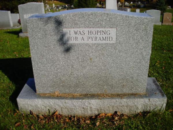 A simple grey funny tombstone with the text "I was hoping for a pyramid".