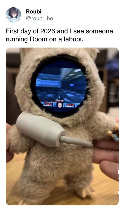 A gamer meme showing a Labubu doll with a screen in its face running the game Doom.