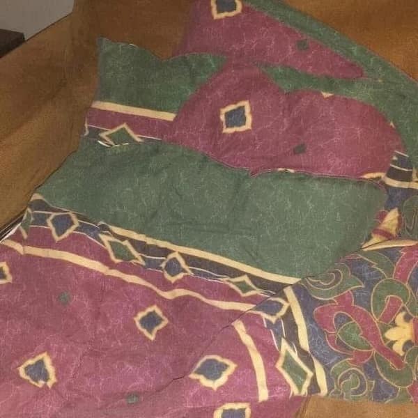 Patterned duvet cover with geometric shapes in hunter green and maroon.