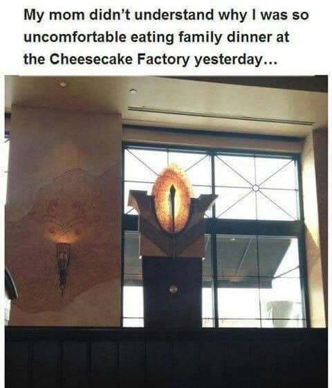 A funny LoTR meme comparing a Cheesecake Factory light fixture to the fiery Eye of Sauron.