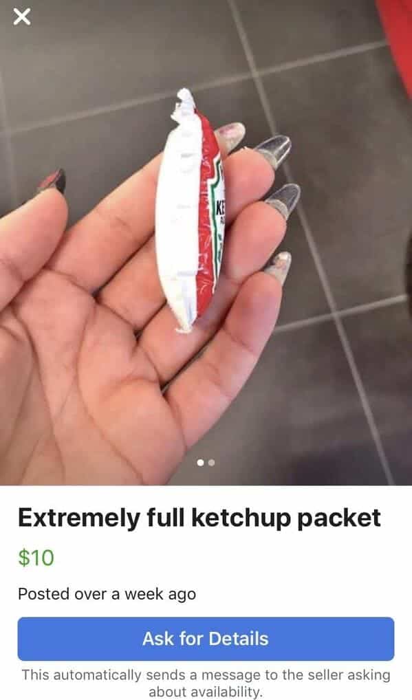 Hand holding a dangerously bloated ketchup packet listed for ten dollars.