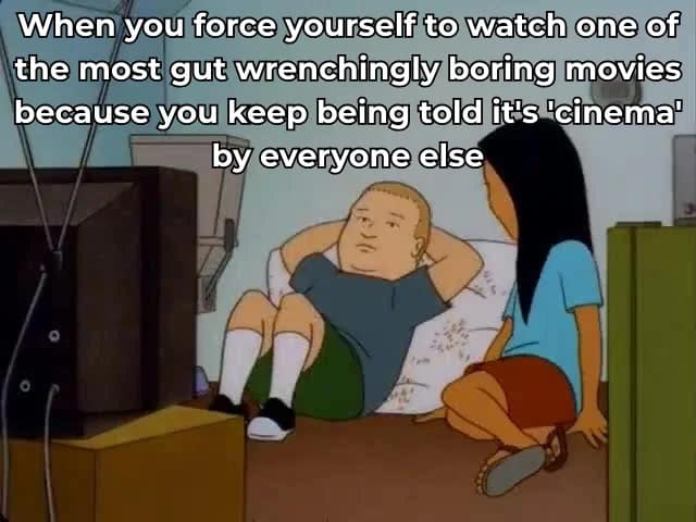 A hilarious meme of Bobby Hill looking bored while forcing himself to watch a boring movie because it is cinema.
