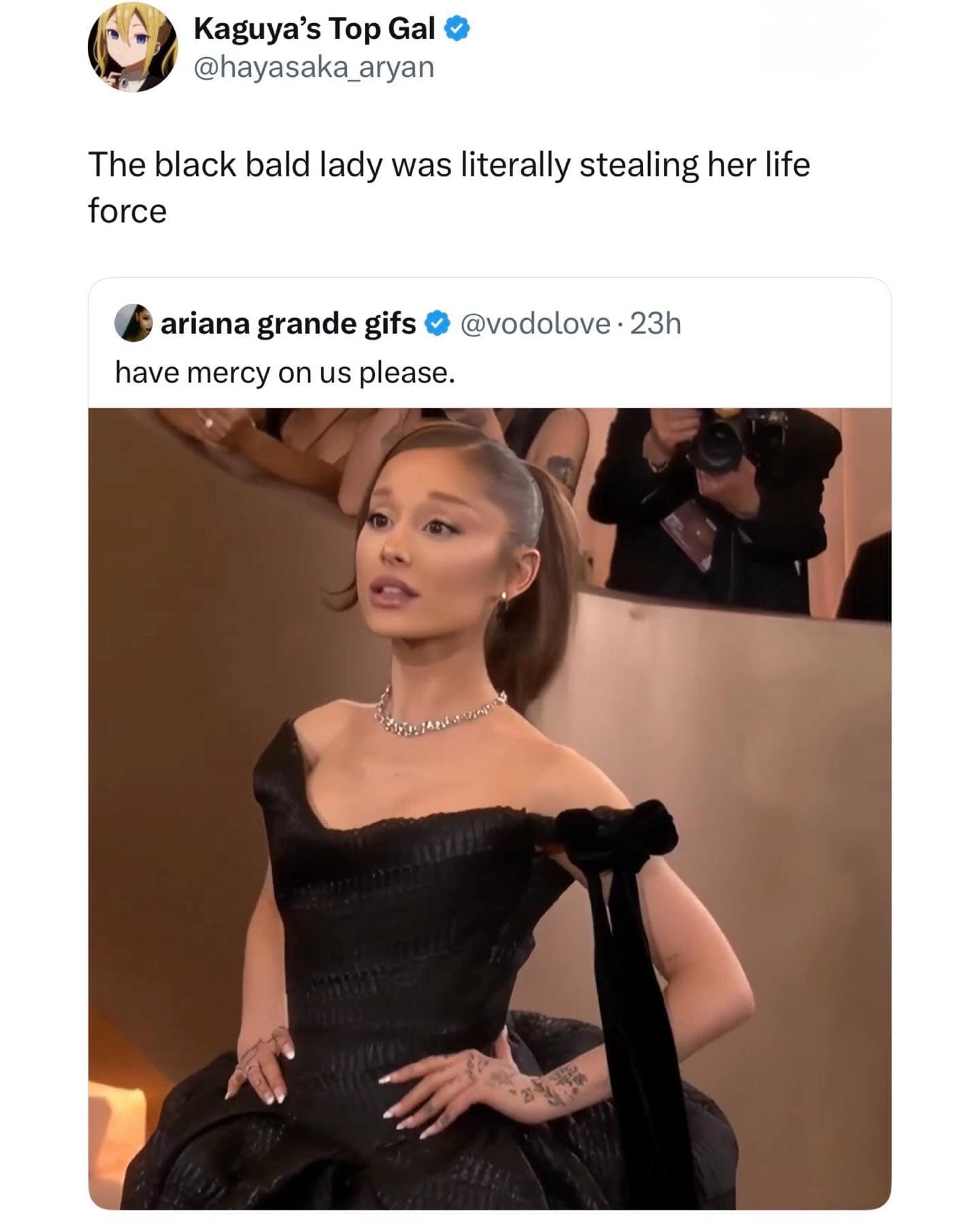 A hilarious meme tweet joking that Ariana Grande stole her look and life force from a bald woman in the background.
