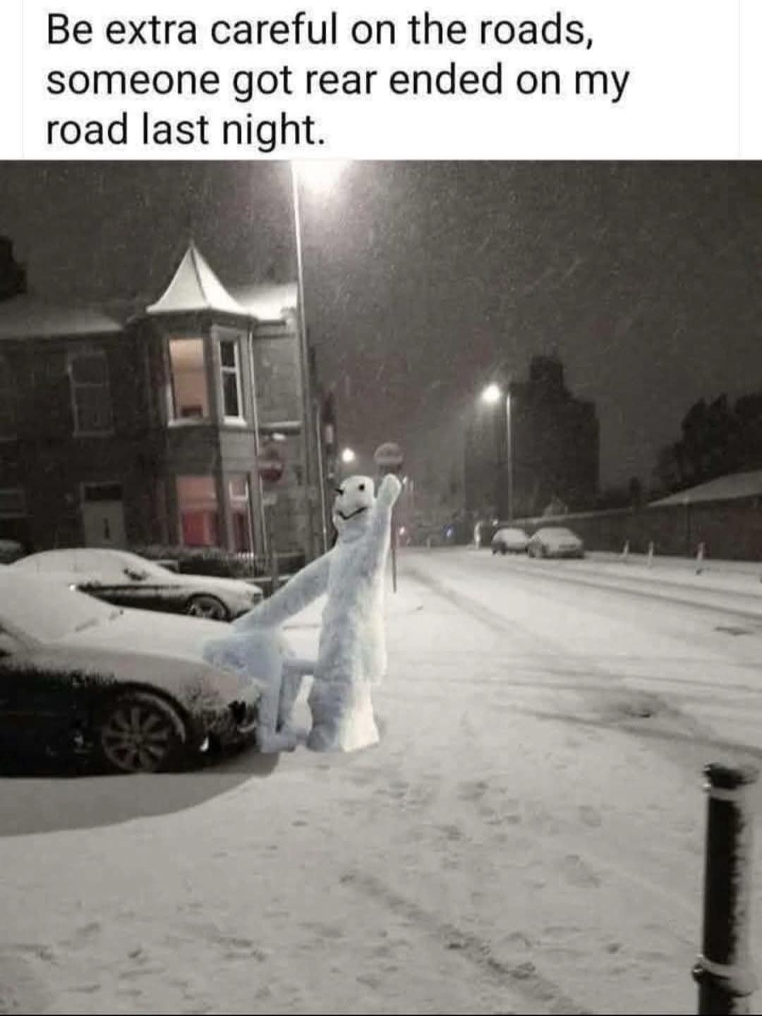 A funny meme photo of a snowman positioned to look like it is rear ending a parked car on a snowy street.