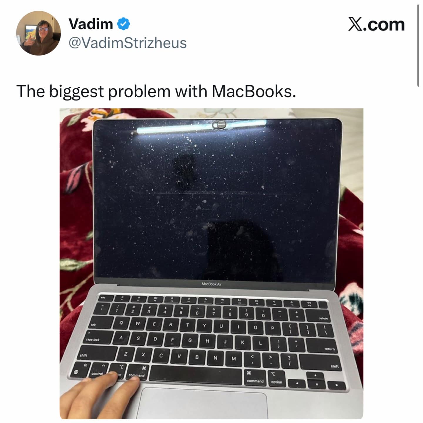 A hilarious meme photo showing the keyboard marks left on a dirty MacBook screen.