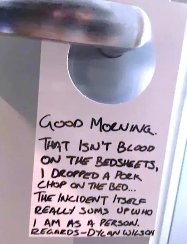 A funny meme photo of a hotel door note explaining a pork chop stain on the bedsheets to the cleaning staff.