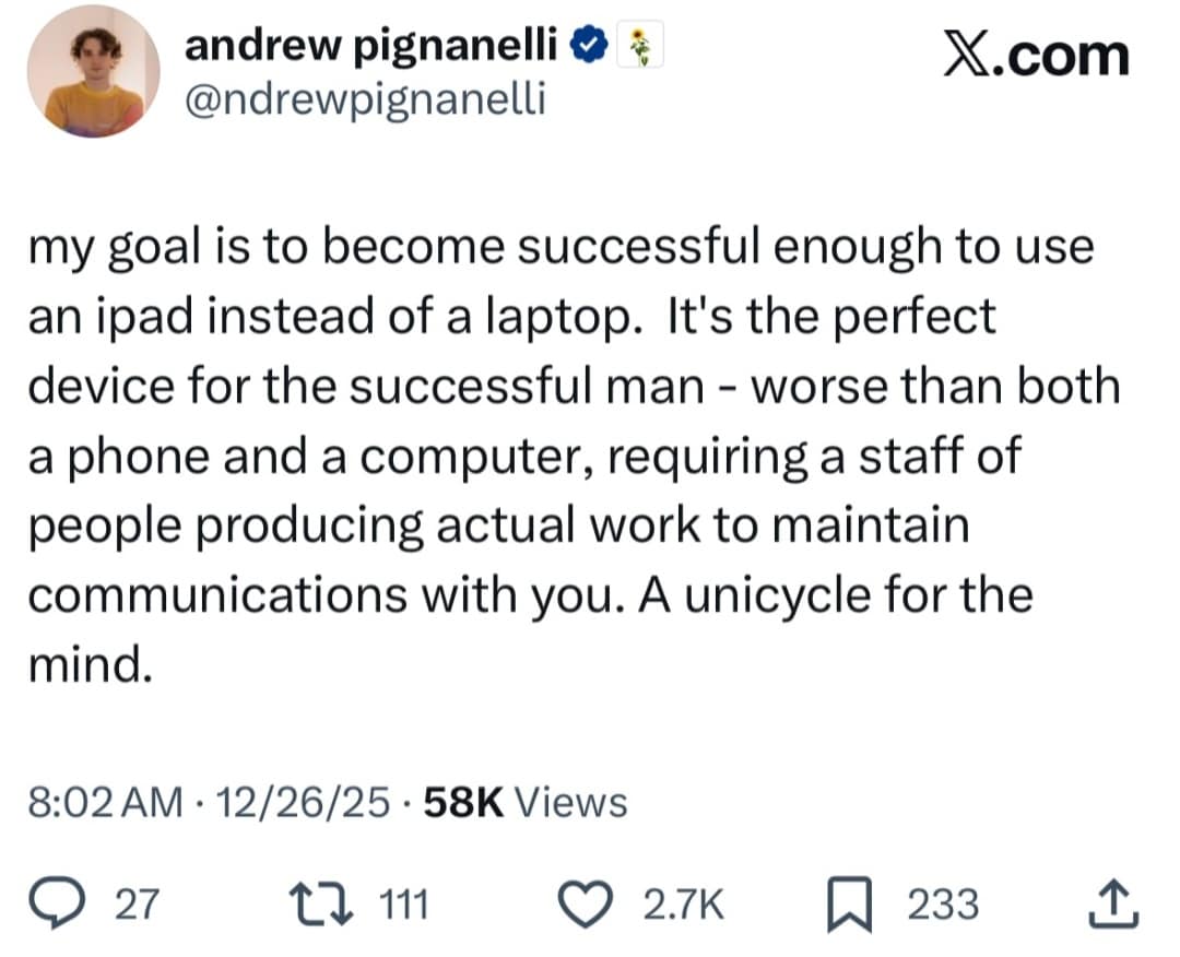 A funny meme tweet claiming using an iPad instead of a laptop is a status symbol for successful men.