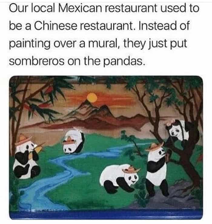 Pandas on a restaurant mural wearing painted-on sombreros and playing guitars.