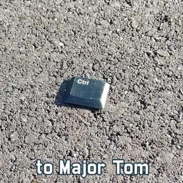 A music meme showing a computer "Ctrl" key lying on the pavement with the text "to Major Tom".