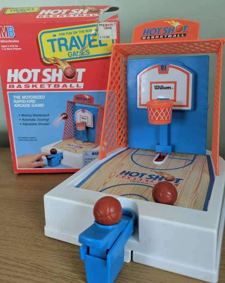 A vintage Milton Bradley Hot Shot Basketball travel game box and the toy set up.