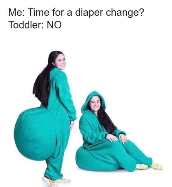 A funny parenting meme showing a person in a green costume with a giant rear end refusing a diaper change.