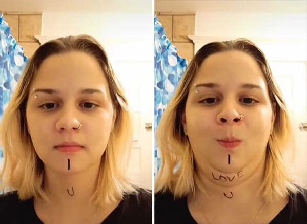Woman using neck folds to connect written letters on chin and neck.