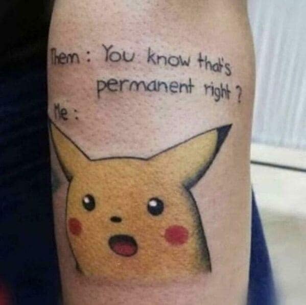 Surprised Pikachu meme tattoo with text about permanence on arm questionable tattoos.