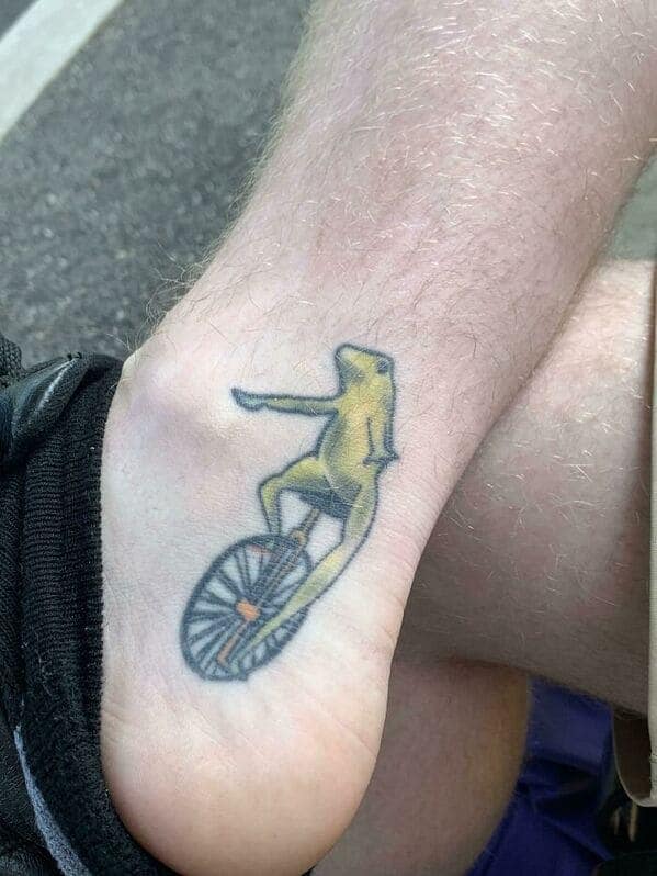 Dat Boi frog on unicycle meme tattoo on ankle questionable tattoos.