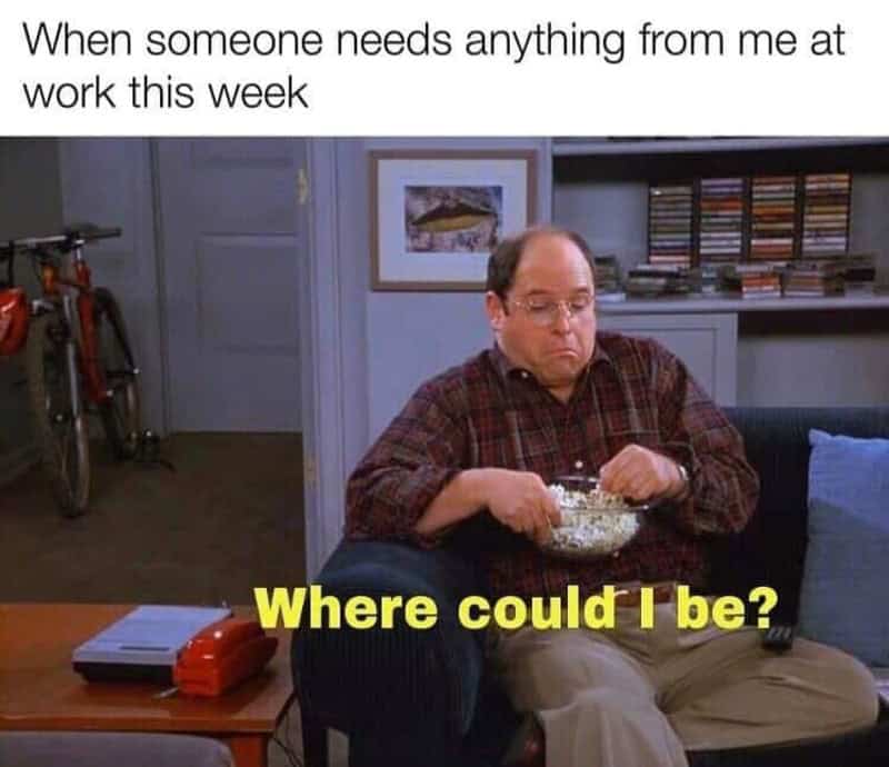 George Costanza eating popcorn on couch avoiding work responsibility.