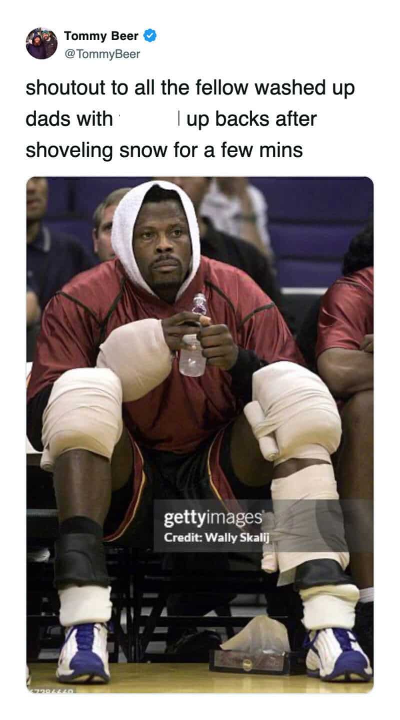 Basketball player Patrick Ewing wrapped in ice packs after clearing driveway