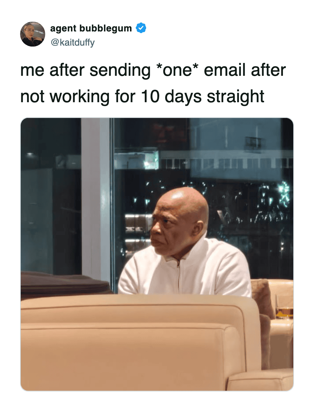 Andre Leon Talley looking exhausted on couch after sending one post-vacation email.