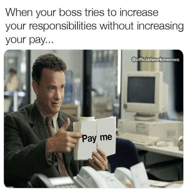 A work meme of Tom Hanks pointing to a book edited to say Pay Me in response to more responsibilities.