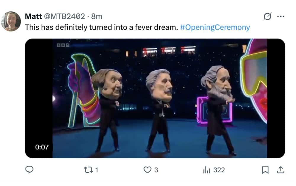 Milan Olympics opening ceremony memes tweet: A video still showing giant bobblehead figures of historical composers dancing on stage, captioned "This has definitely turned into a fever dream."