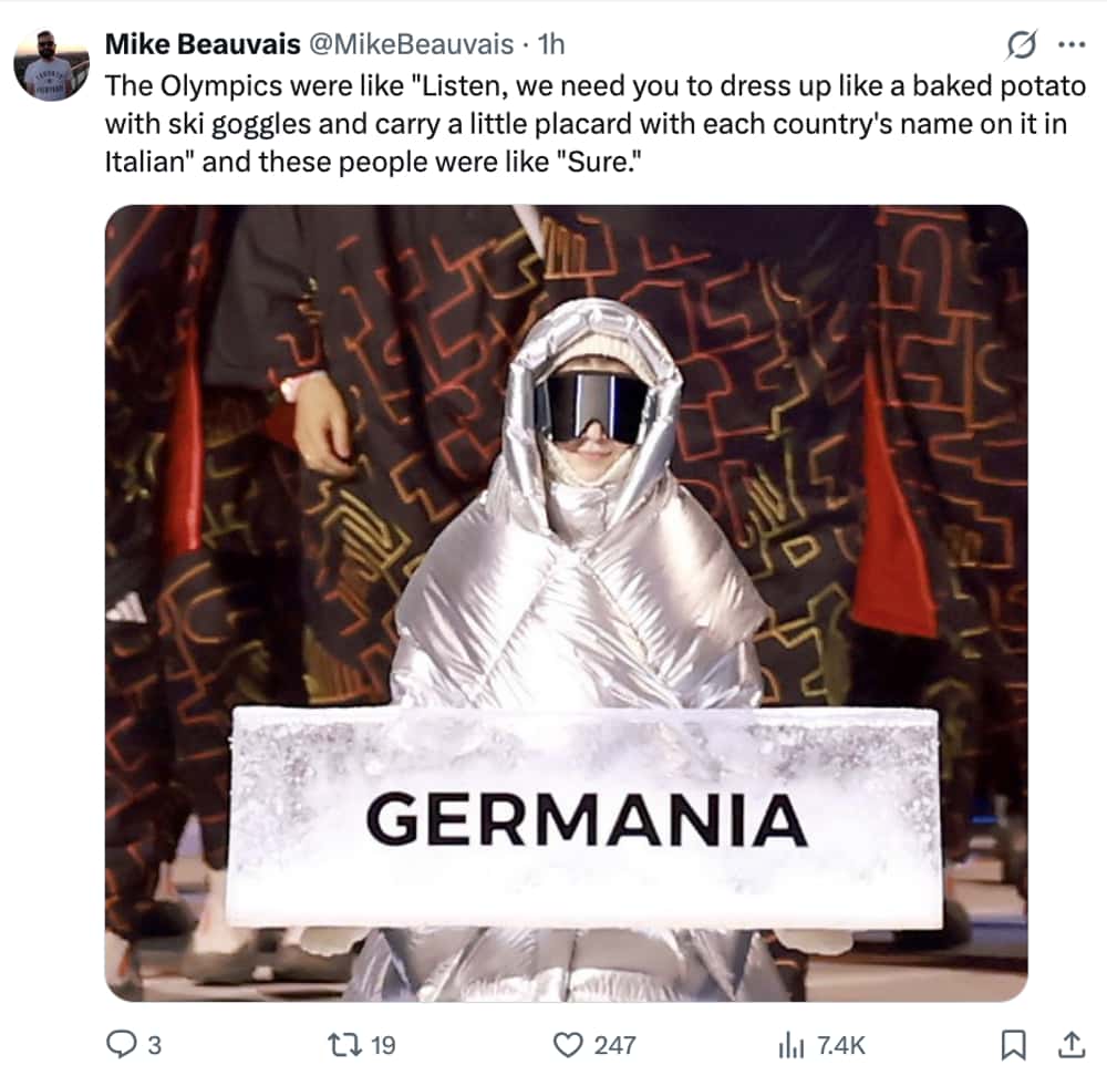 Milan Olympics opening ceremony memes tweet: A placard bearer for "Germania" wearing a puffy silver foil outfit and ski goggles, described as dressing like a "baked potato."