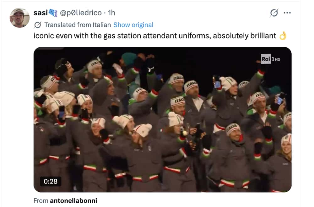 Milan Olympics opening ceremony memes tweet: The Italian team cheering in grey jumpsuits, roasted in the caption for looking like "gas station attendant uniforms."