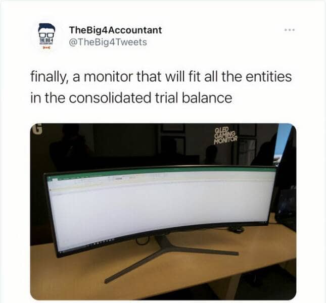 Massive ultra-wide gaming monitor displaying a single Excel spreadsheet to fit a consolidated trial balance.