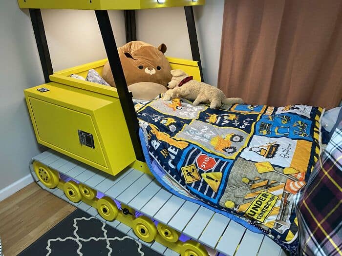Yellow bulldozer construction vehicle custom bed for a child. Features wooden track details and a truck cab.