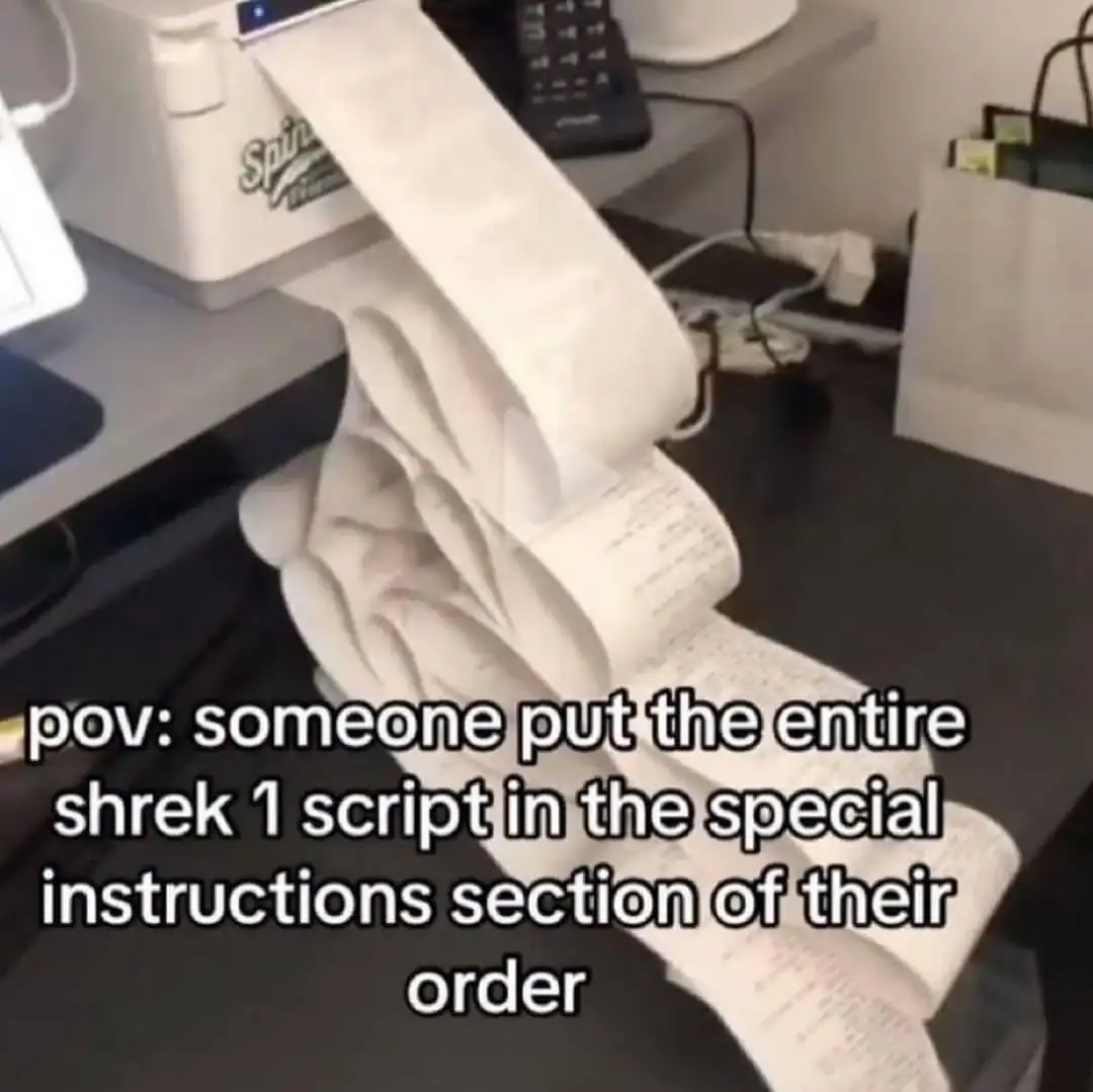 A long, unspooling printer receipt containing the entire text of the Shrek movie script as a special instruction.