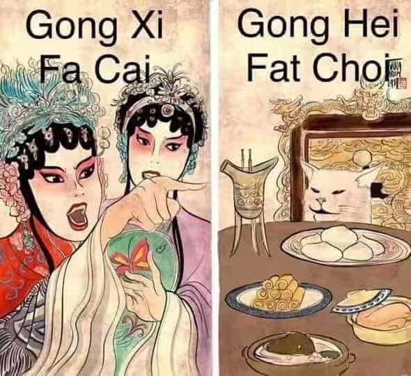 A linguistic "Woman Yelling at a Cat" Lunar New Year meme where the woman screams "Gong Xi Fa Cai" (Mandarin) and the cat replies "Gong Hei Fat Choi" (Cantonese).