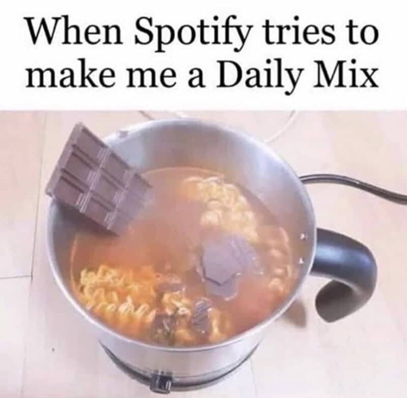 A bar of chocolate being added to a pot of ramen noodles as a Spotify mix.