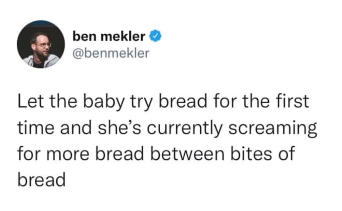 A wholesome old meme tweet describing a baby's immediate addiction to carbs, noting she is currently "screaming for more bread between bites of bread."
