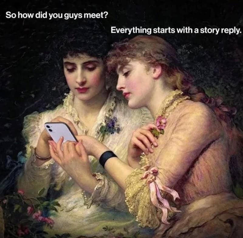 classical art meme: Two Victorian-style women in elegant dresses huddled together looking at a modern white iPhone. Text: "So how did you guys meet? Everything starts with a story reply.".