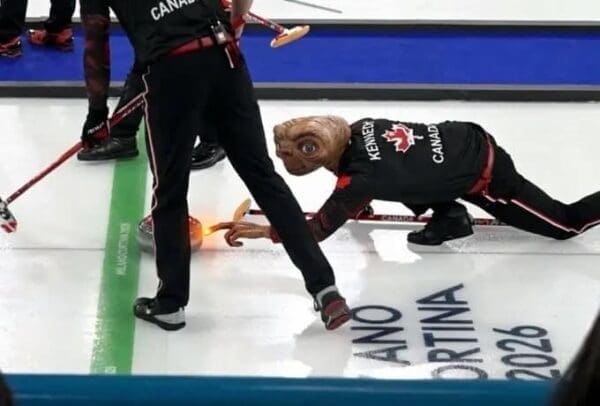 A hilarious curling finger meme that swaps the athlete with E.T., using his long, glowing finger to tap the stone during the match.
