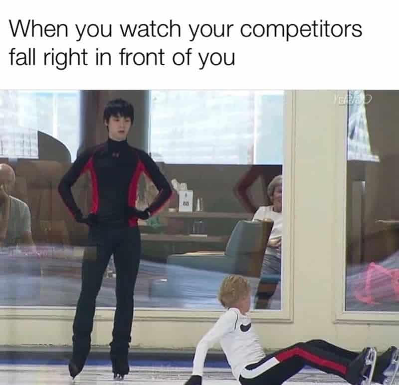 A figure skating meme showing Yuzuru Hanyu standing with hands on hips watching a competitor fall, captioned about watching rivals fail.